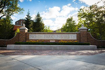 Photo of North Park University sign. Link to Gifts of Appreciated Securities.